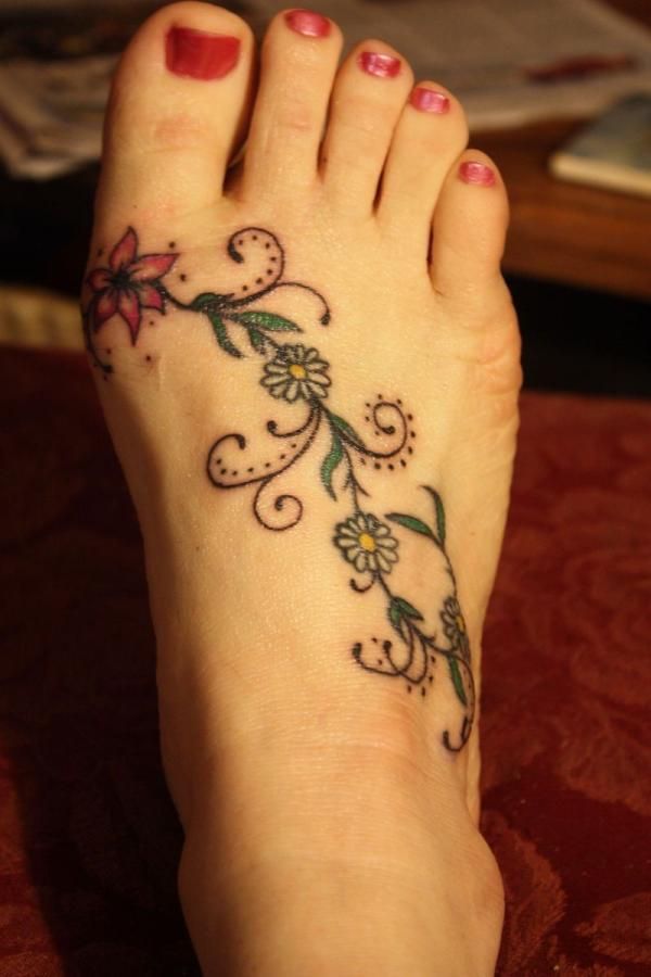 Daisy Flowers Vine Tattoo On Girl Foot