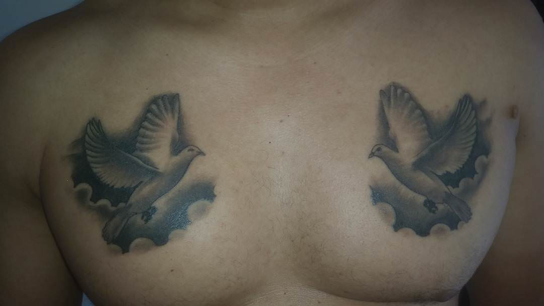 Dark Grey Flying Dove Tattoos On Chest