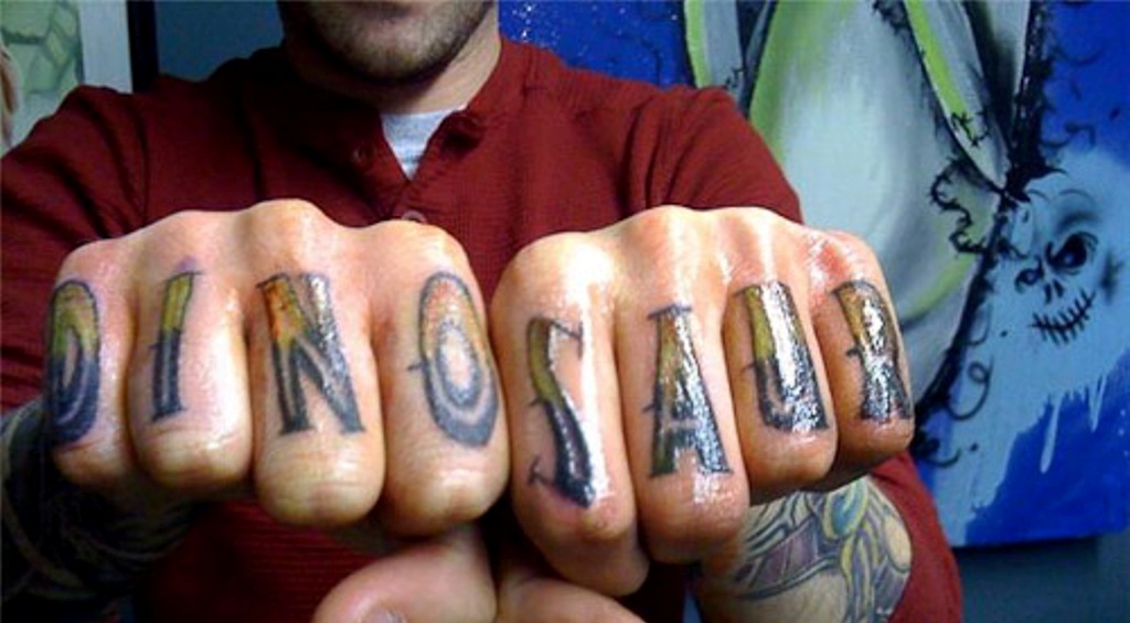 Dinosaur Word Tattoo On Both Hand Fingers