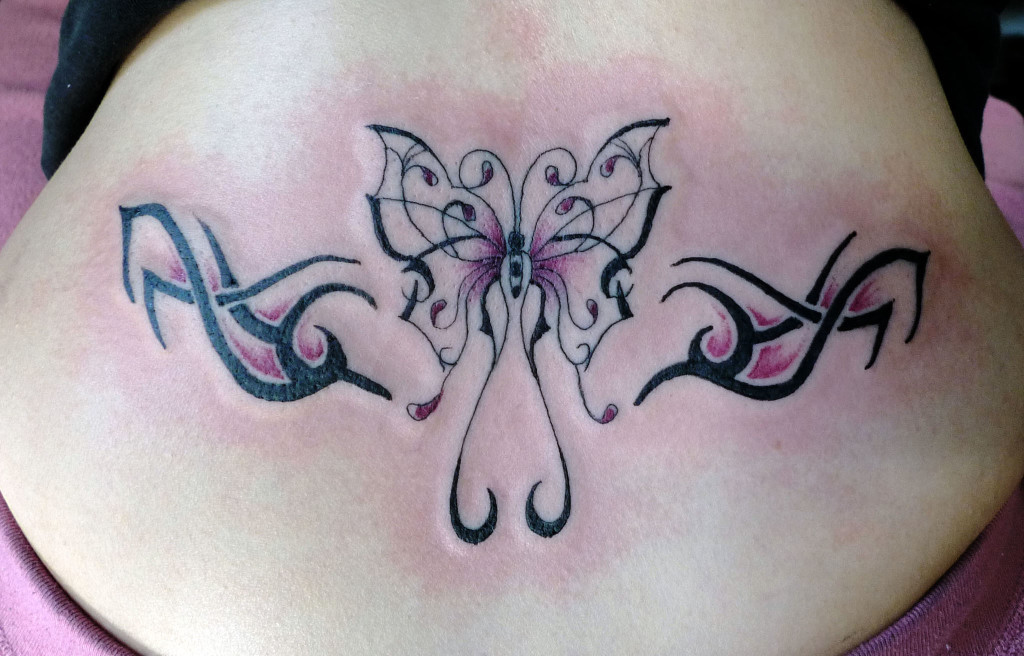 Fabulous Tribal Butterfly Tattoo On Lower Back