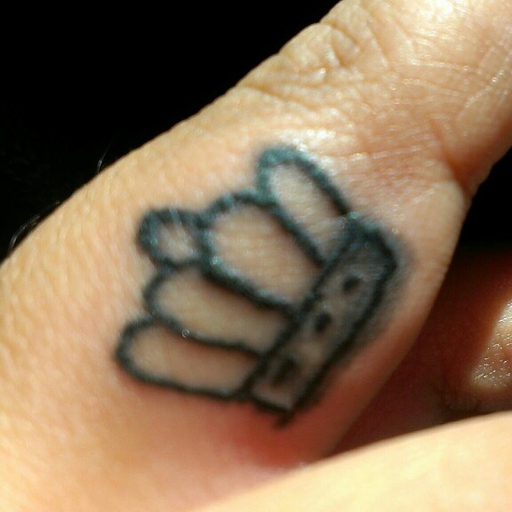 Finger Crown Tattoo Closeup Image
