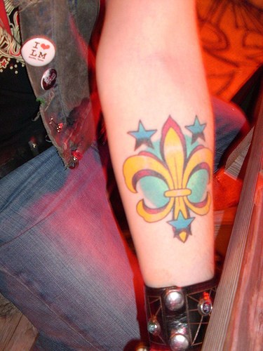 Fleur De Lis With Stars Tattoo On Forearm