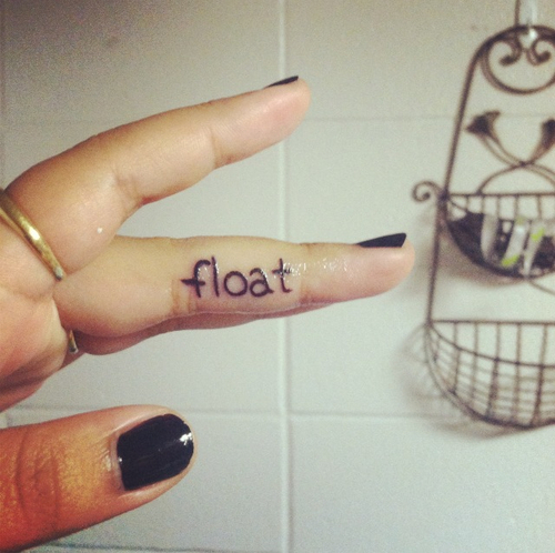 Float Word Tattoo On Girly Inner Finger