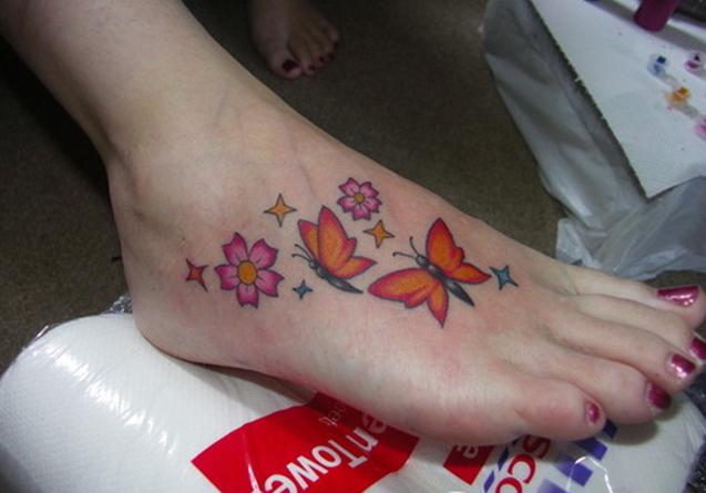 Floral Stars Butterflies Tattoo On Girl Foot