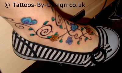 Floral Vine With Butterflies Tattoo On Foot For Girls