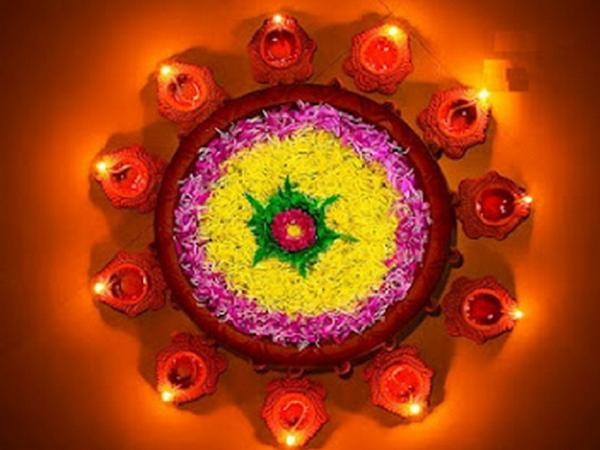 Flowers Rangoli Design With Diyas For Diwali Festival