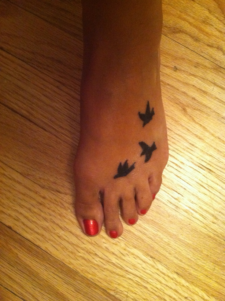 Flying Birds Silhouette Tattoo On Foot For Women