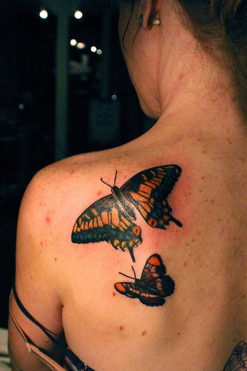 Flying Butterflies Tattoo On Upper Back For Girls