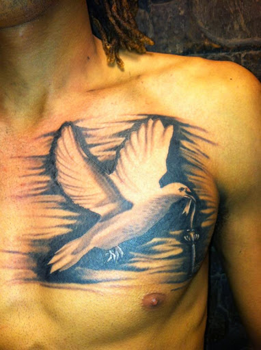 Flying Dove With Cross Tattoo On Man Chest