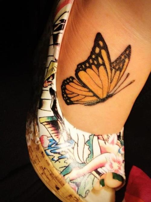 Flying Monarch Butterfly Tattoo On Rib Cage