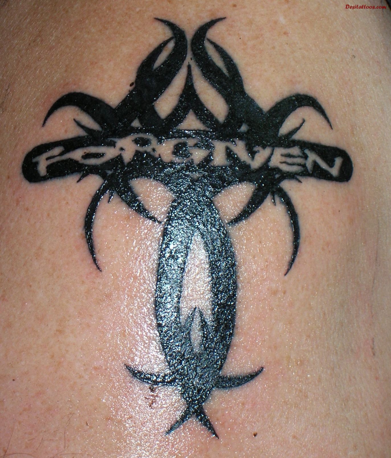 Forgiven Tribal Cross Christian Tattoo