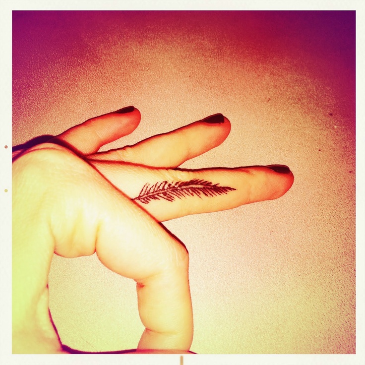 Girl Have Feather Tattoo On Finger