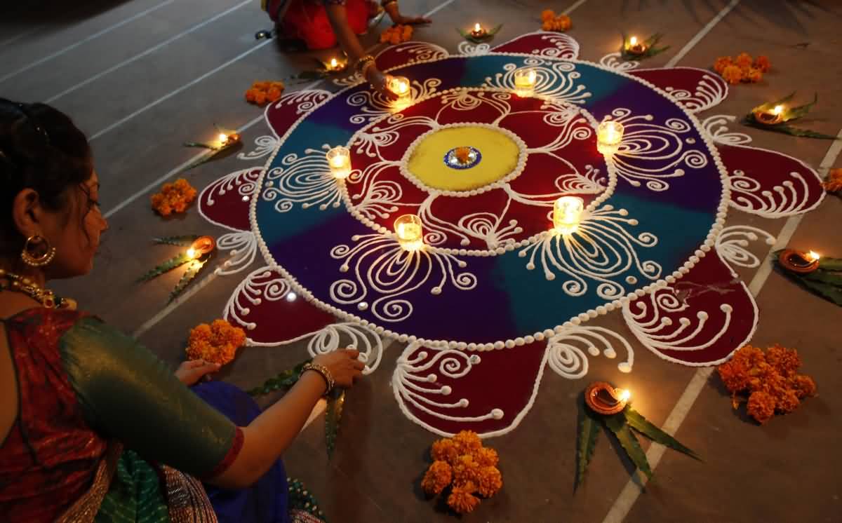 Girls Decorating Rangoli For Diwali