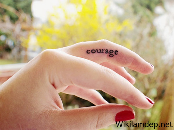 Girly Finger Courage Word Tattoo