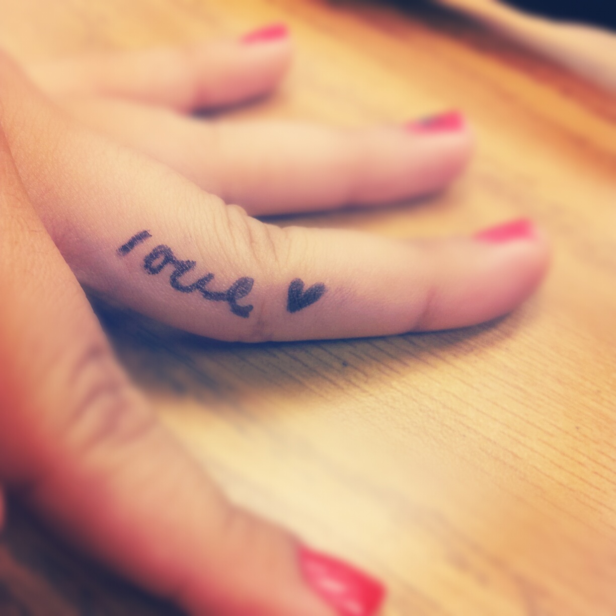 Girly Finger Love Word With Heart Tattoo