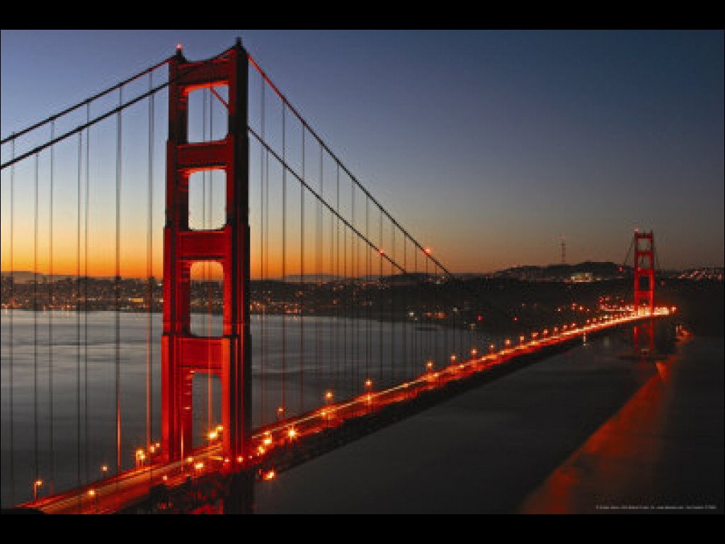 Golden Gate Bridge Lit Up During Sunset