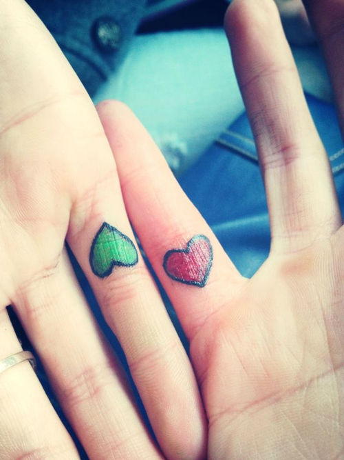 Green And Red Heart Tattoos On Fingers