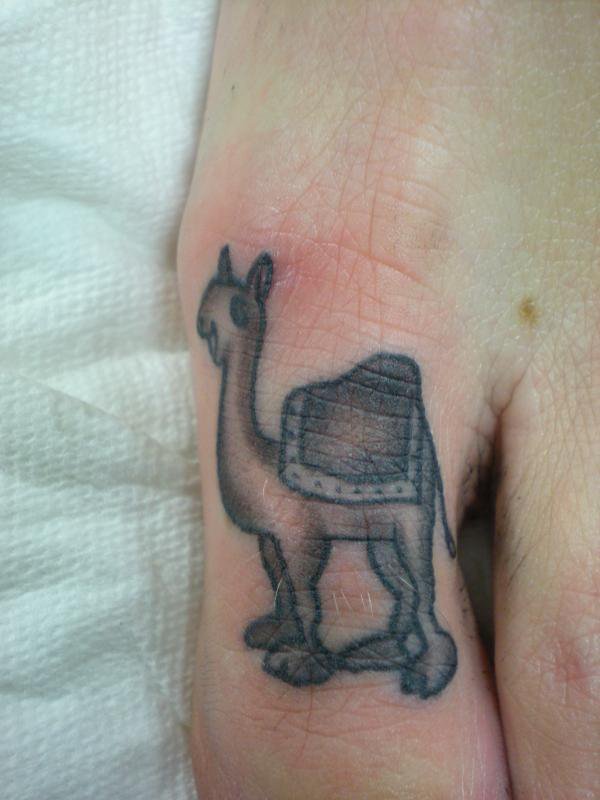 Grey Camel Tattoo On Toe
