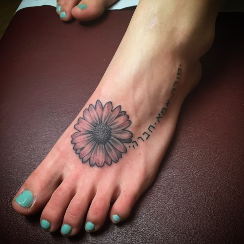 Grey Daisy Flower Tattoo On Left Foot
