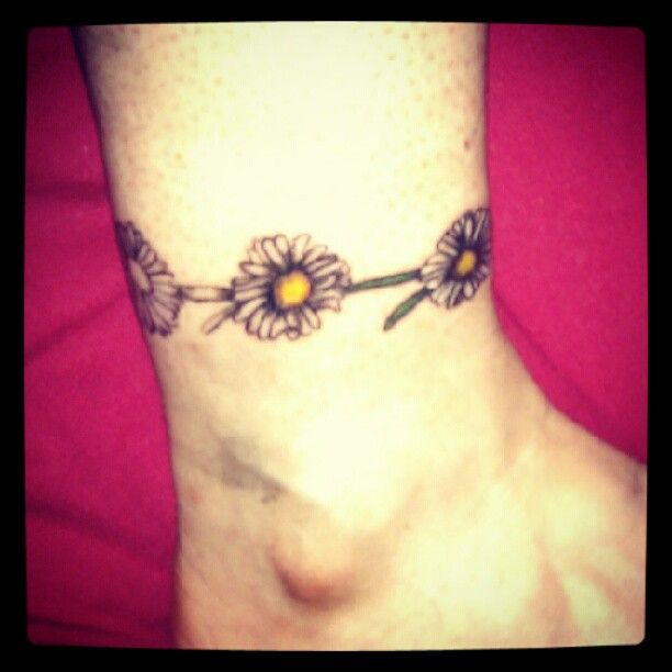 Grey Daisy Flowers Tattoo On Ankle