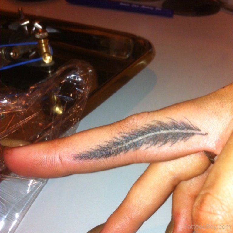 Grey Feather Tattoo On Side Finger