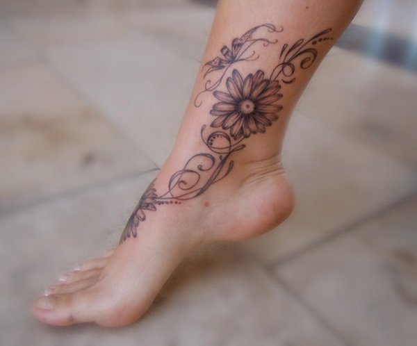 Grey Ink Daisy Flower Tattoo On Ankle