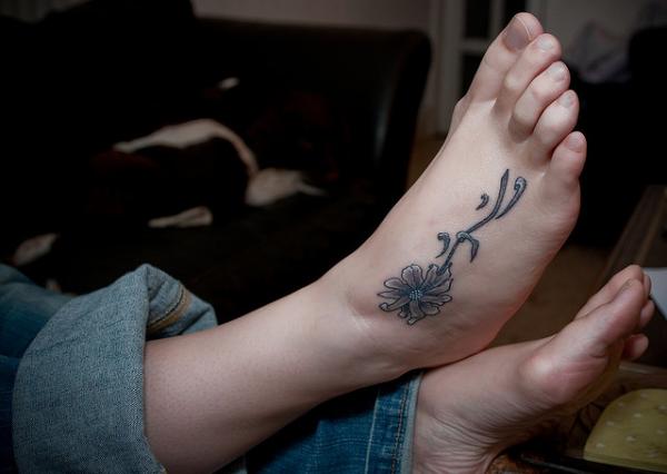 Grey Ink Daisy Flower Tattoo
