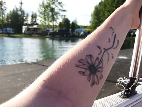 Grey Ink Daisy Tattoo On Forearm