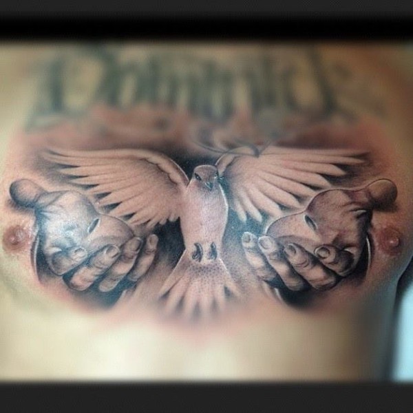 Grey Ink Hands And Dove Tattoo On Chest