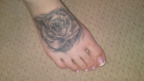 Grey Ink Rose Tattoo On Foot
