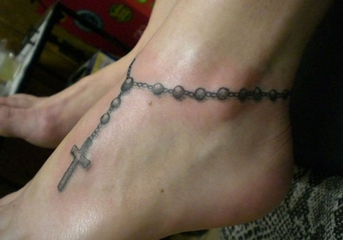 Grey Rosary On Foot Tattoo