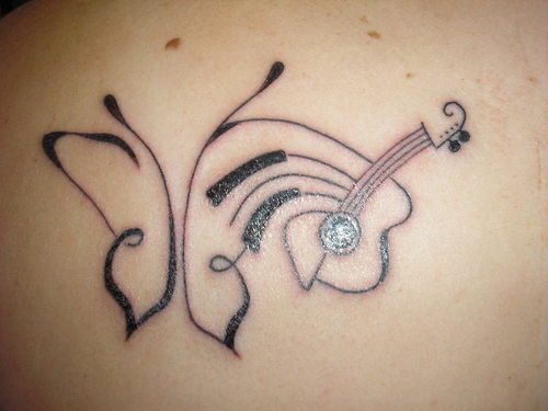 Guitar Player Tribal Butterfly Tattoo