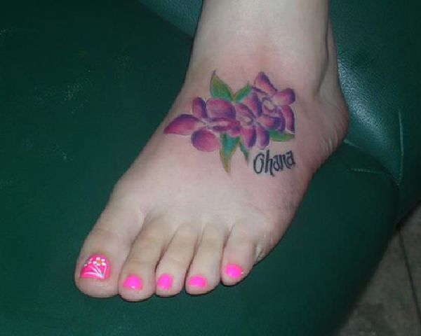 Hawaiian Flowers Tattoo On Girl Foot