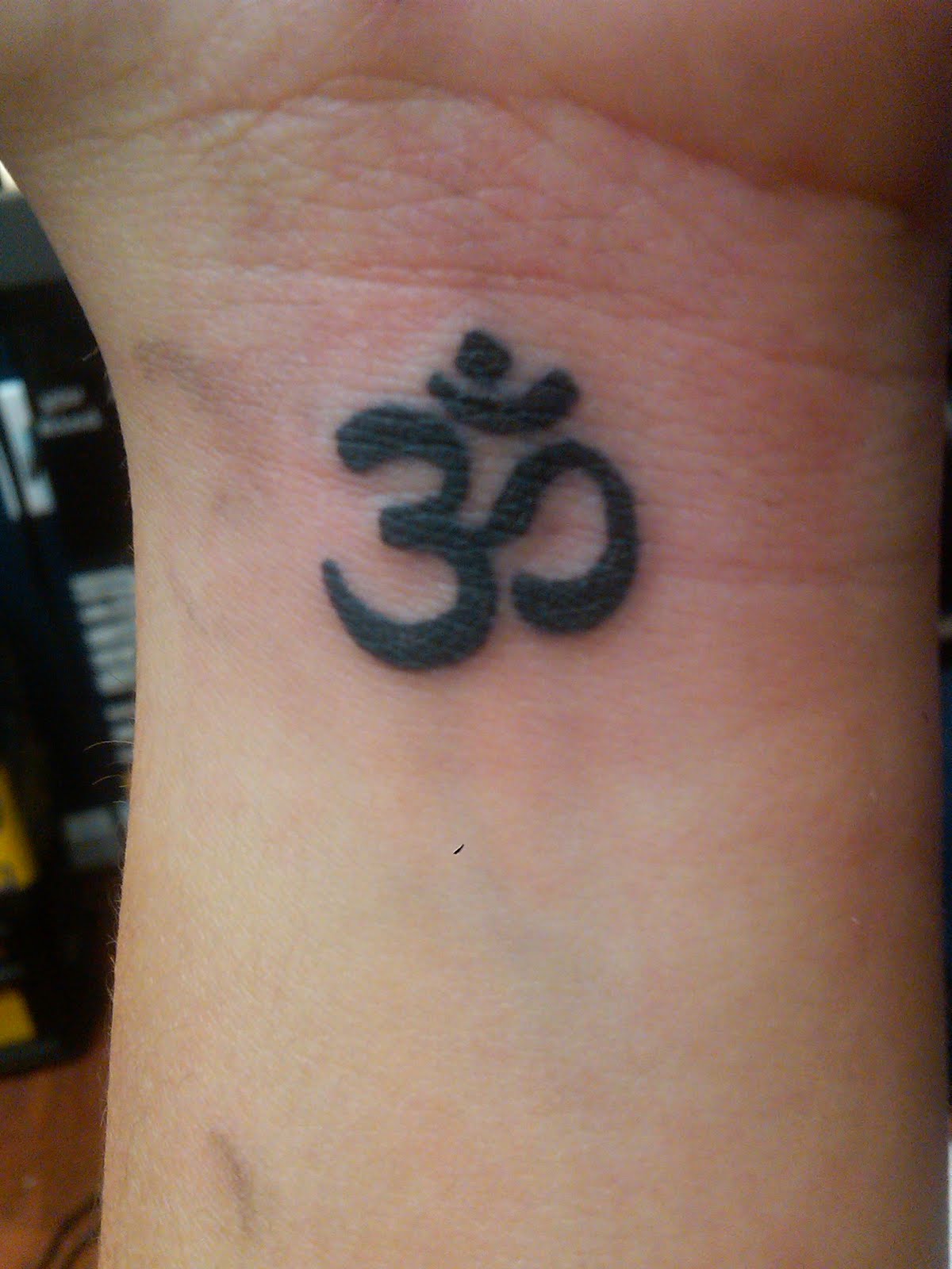 Hindu Om Religious Tattoo On Wrist For Men