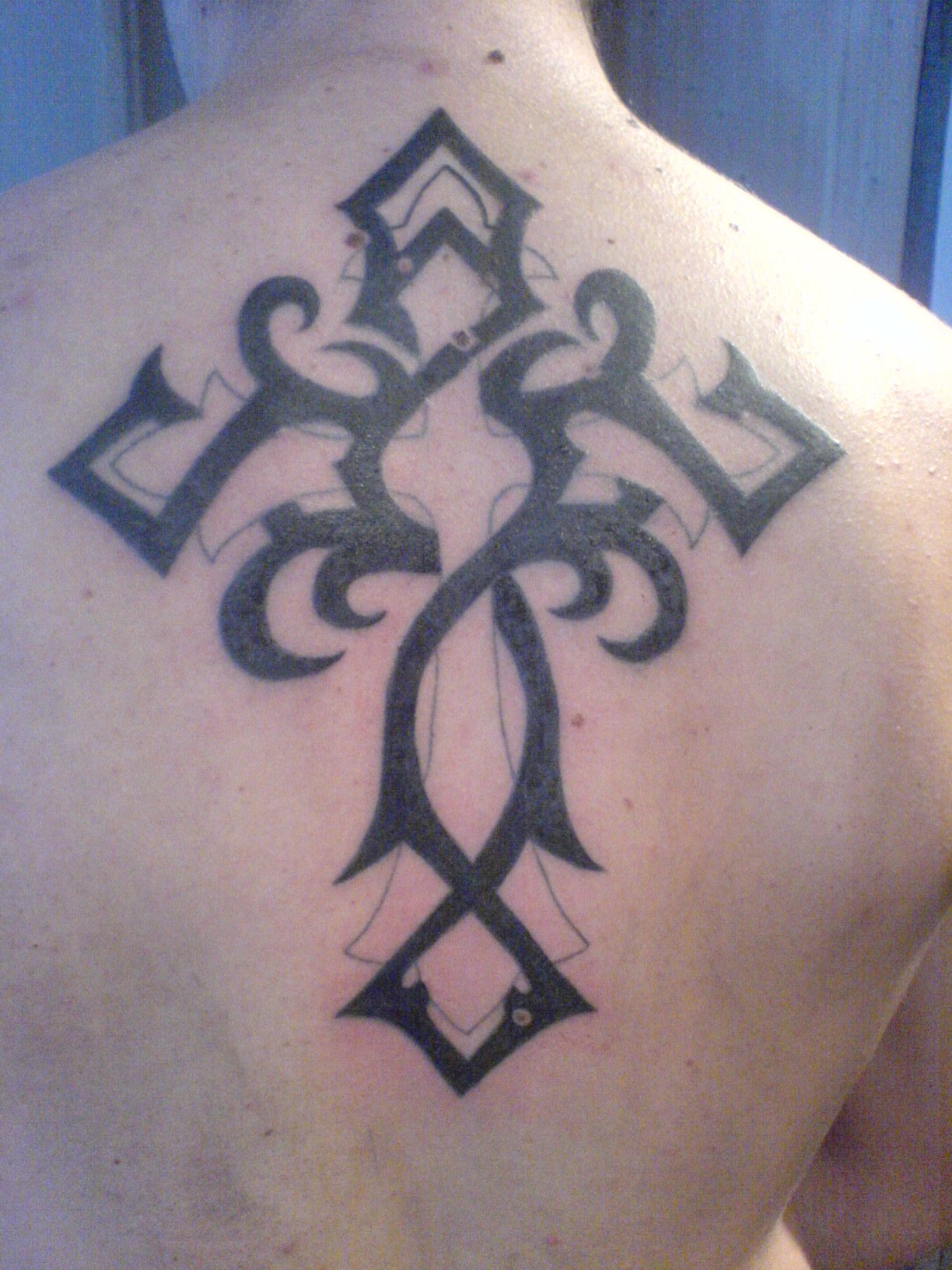 Impressive Christian Tribal Cross Tattoo On Upper Back
