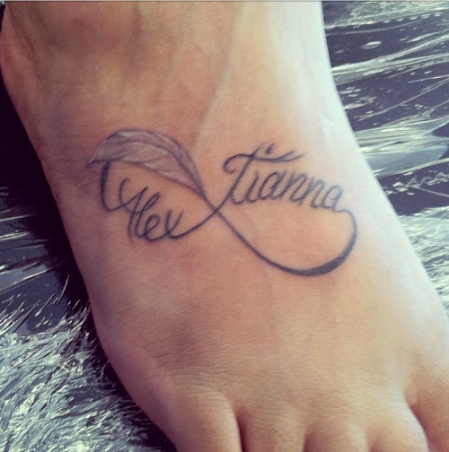 Infinity Names With Feather Tattoo On Foot