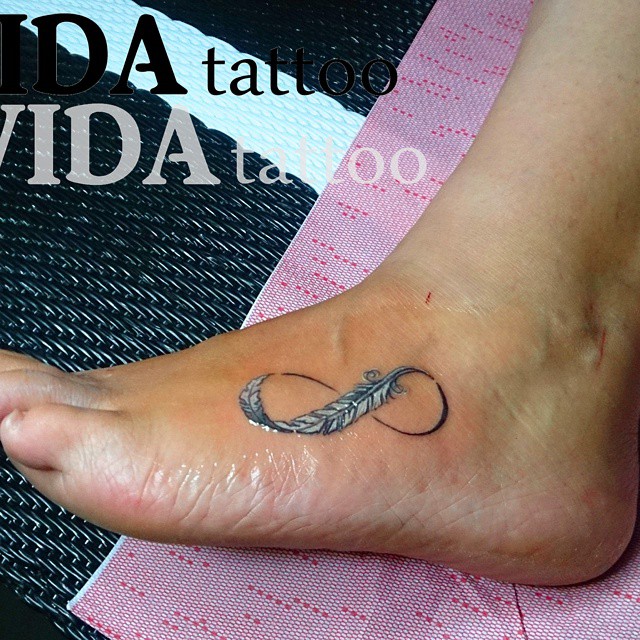 Infinity White Feather Tattoo On Left Foot