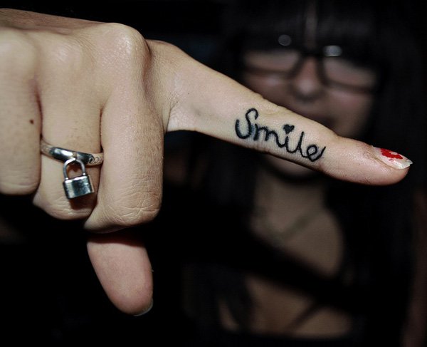Inner Finger Loves Smile Word Tattoo For Girls