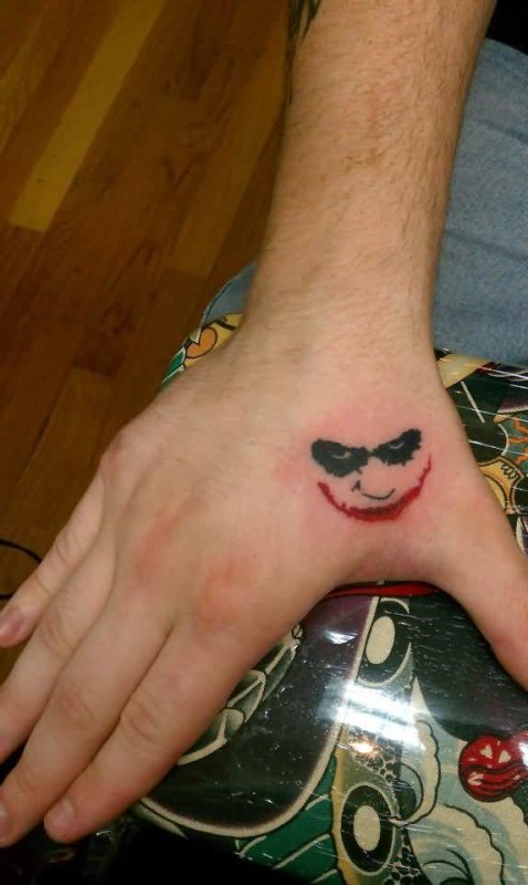 Joker Face Tattoo On Side Hand