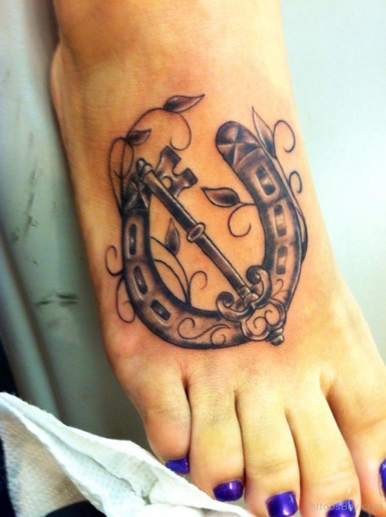 Key To Horse Shoe Tattoo On Girl Foot