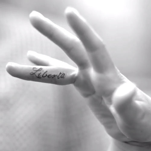 Liberta Tattoo On Side Finger