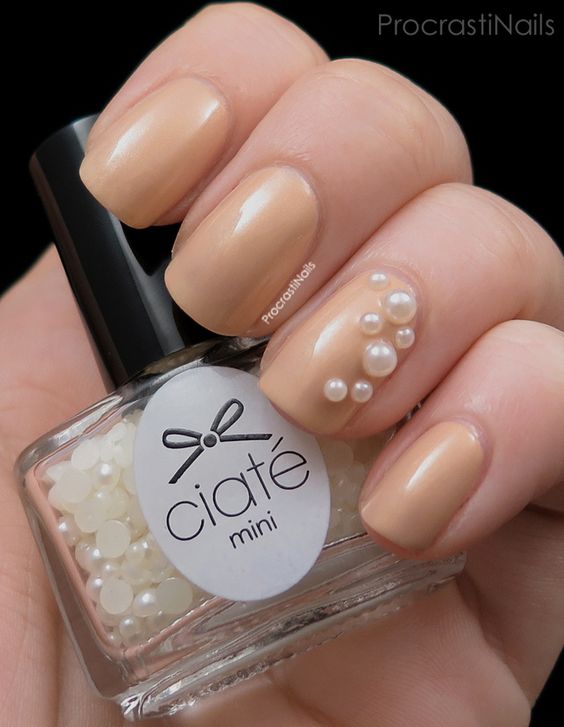 Light Brown Nails With Accent Pearls Nail Art