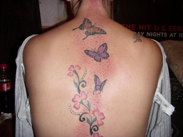 Lovely Butterflies With Flowers Tattoo On Back