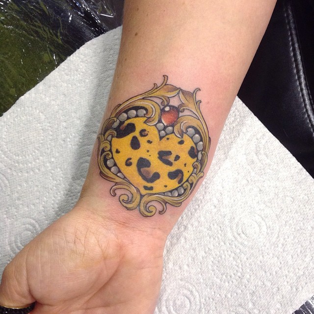 Lovely Cheetah Print Vintage Heart Tattoo On Wrist