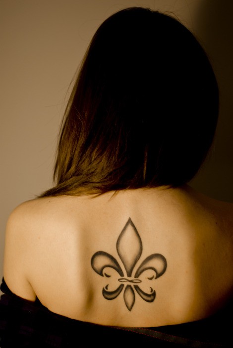 Lovely Fleur De Lis Tattoo On Upper Back For Girls