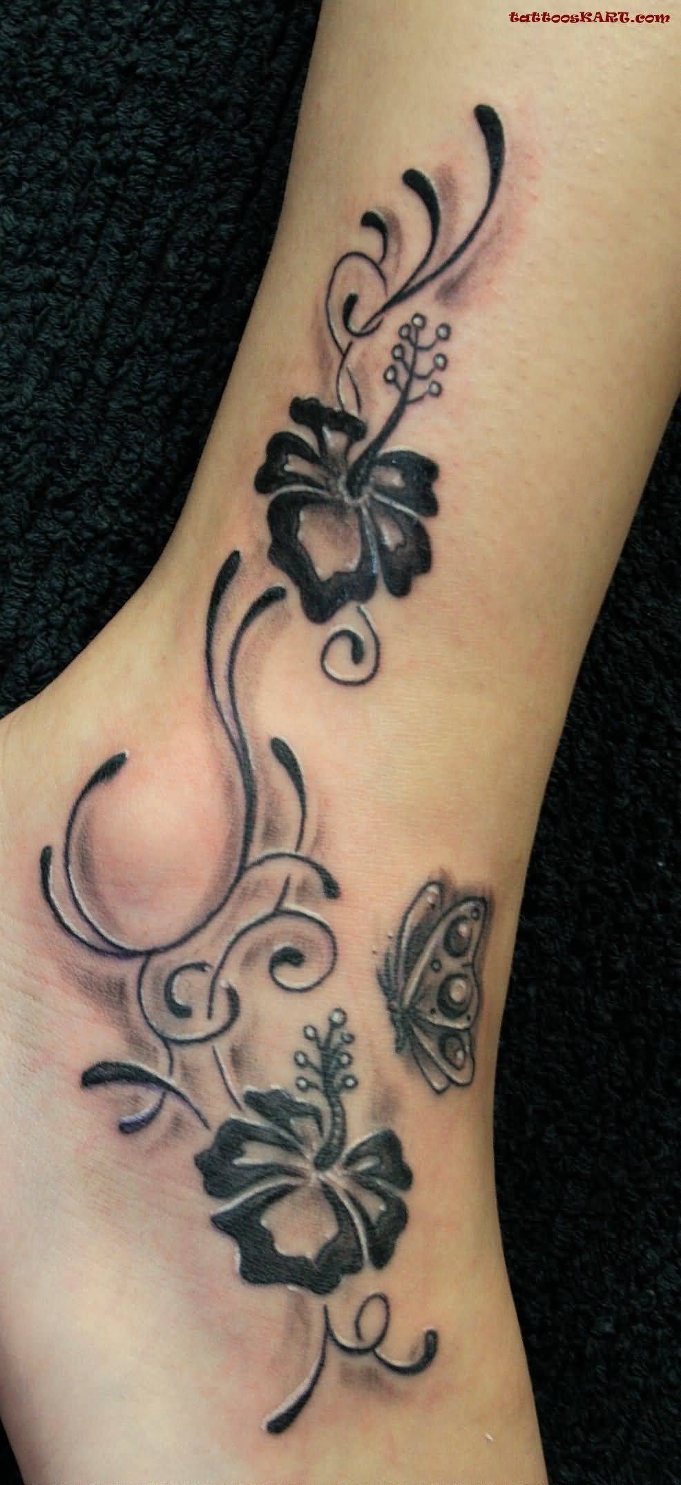 Lovely Hibiscus Flowers With Butterfly Tattoo On Foot And Ankle