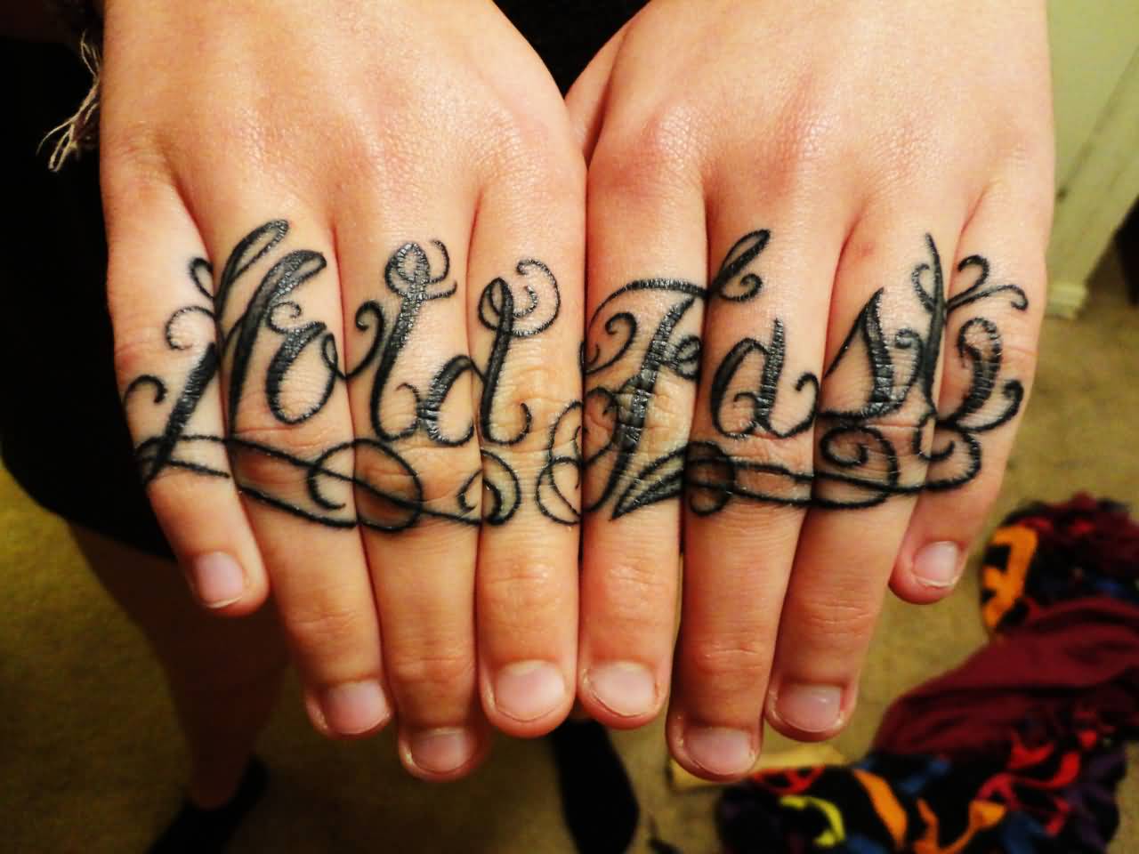 Lovely Hold Fast Fingers Tattoos
