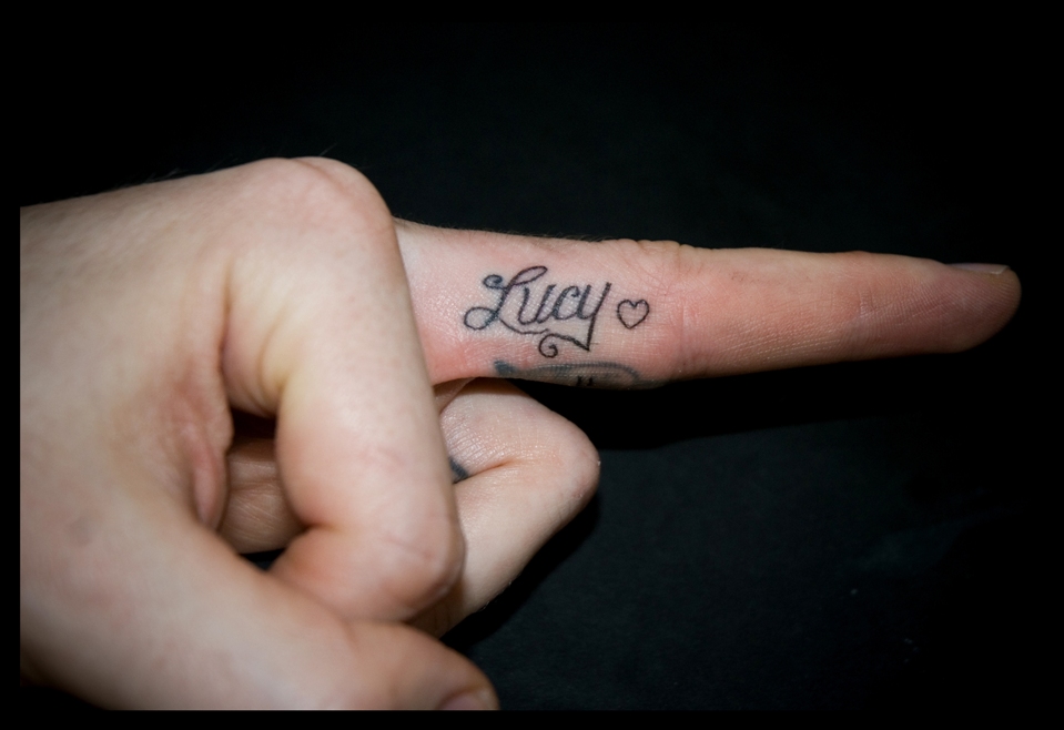 Lucy Inner Finger Tattoo