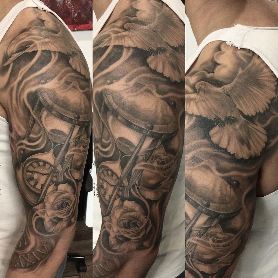 Man With Grey Ink Dove Tattoo On Left Half Sleeve