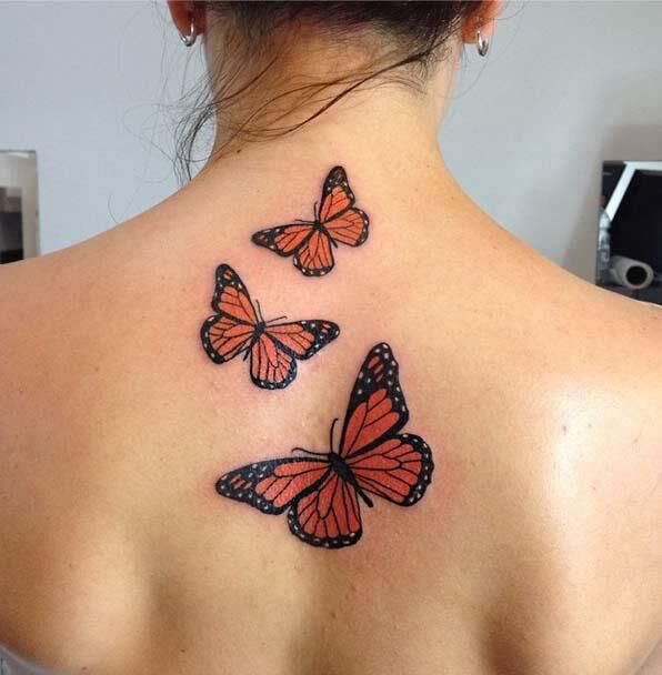 Monarch Butterflies Tattoo On Girl Upper Back